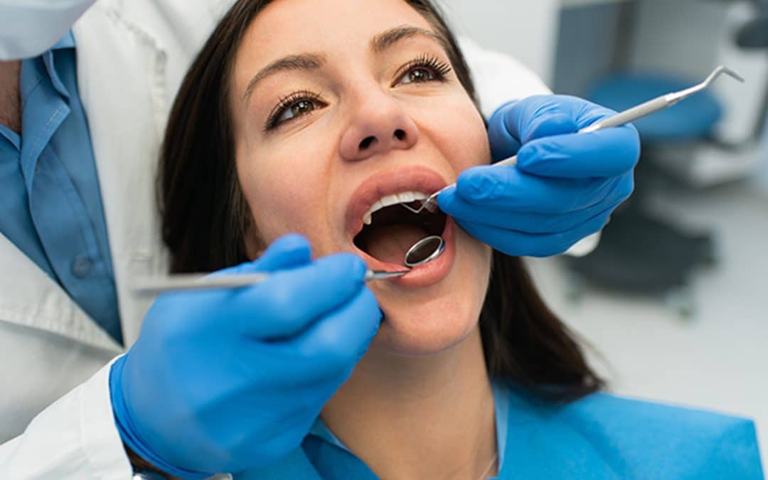 Woman getting a routine dental exam every 6 months in North Ridgeville, OH